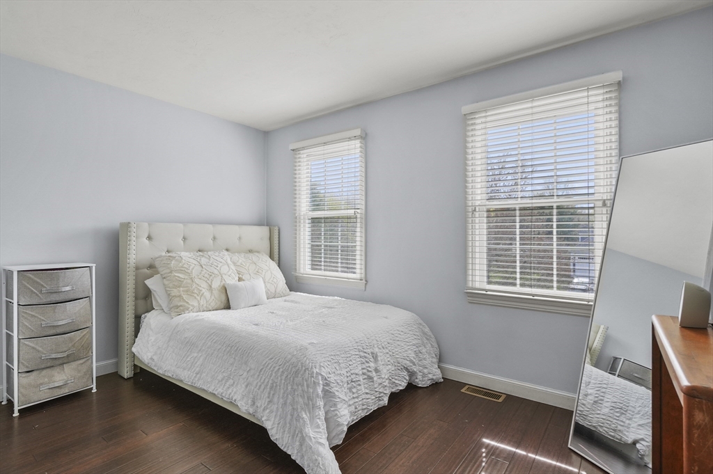 12 Peach Tree Drive Sutton, MA 01590 - Photo 28 of 37 a bedroom with a bed and wooden floor