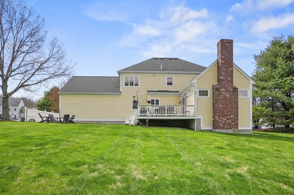 12 Peach Tree Drive Sutton, MA 01590 - Photo 31 of 37 a front view of a house with a yard
