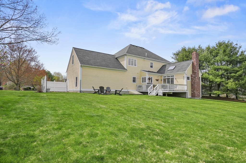 12 Peach Tree Drive Sutton, MA 01590 - Photo 32 of 37 a view of a house with a big yard and large trees