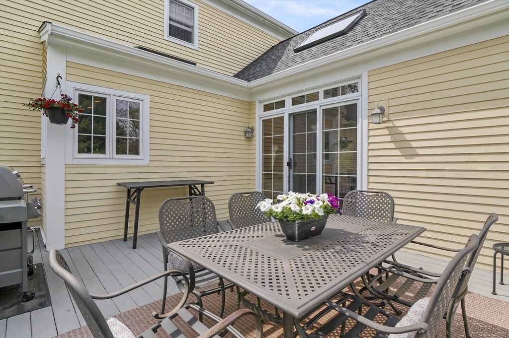 12 Peach Tree Drive Sutton, MA 01590 - Photo 33 of 37 a view of a deck with a table and chairs