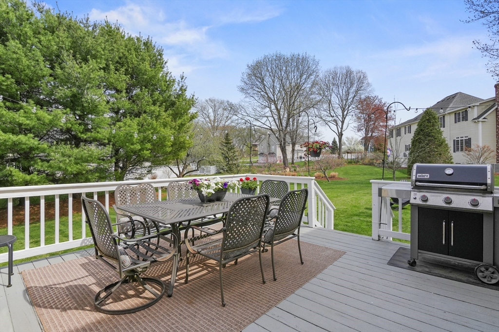 12 Peach Tree Drive Sutton, MA 01590 - Photo 34 of 37 a view of a chair and table on the wooden deck