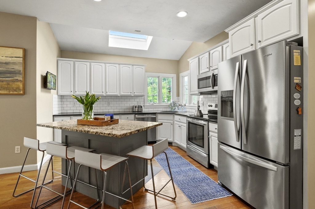 12 Peach Tree Drive Sutton, MA 01590 - Photo 7 of 37 a kitchen with stainless steel appliances granite countertop a refrigerator a stove a sink and a refrigerator