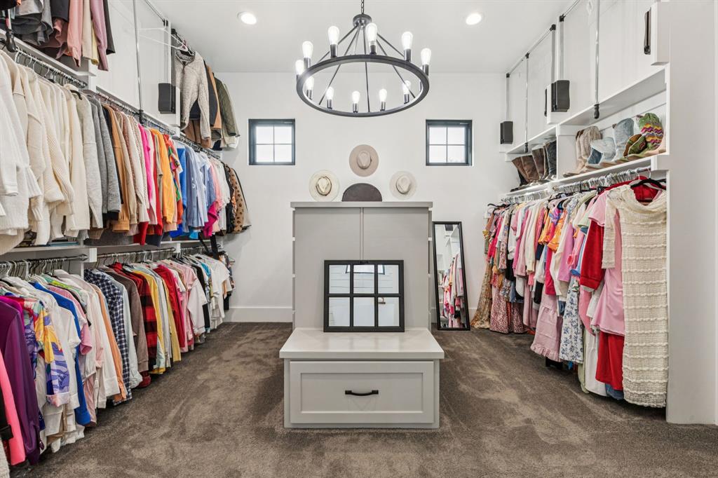2577 Lone Star Road Celina, TX 75009 - Photo 13 of 40 a view of walk in closet with clothes and shoes