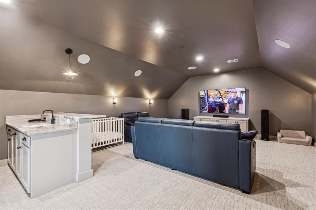 2577 Lone Star Road Celina, TX 75009 - Photo 22 of 40 a view of a kitchen with furniture and a flat screen tv