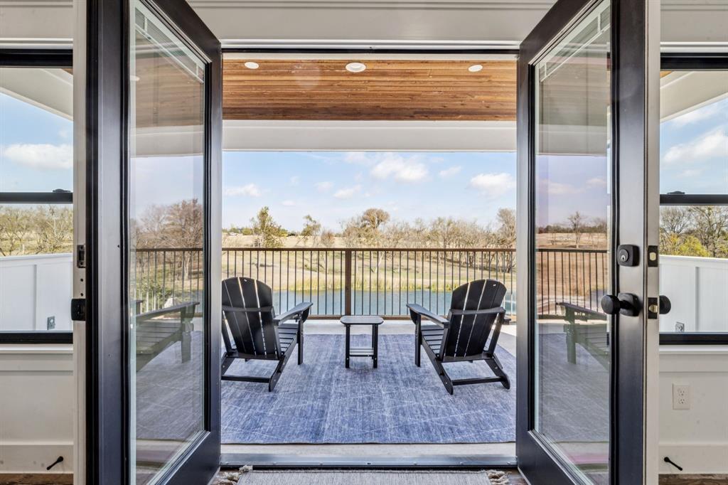 2577 Lone Star Road Celina, TX 75009 - Photo 23 of 40 a view of a city from a balcony with furniture