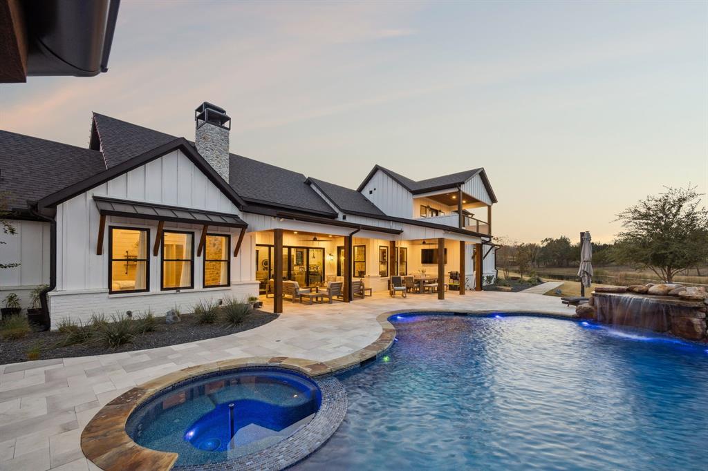 2577 Lone Star Road Celina, TX 75009 - Photo 25 of 40 a view of a house with swimming pool and sitting area