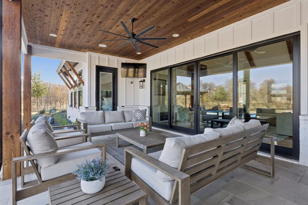 2577 Lone Star Road Celina, TX 75009 - Photo 27 of 40 a living room with furniture ceiling fan and a large window