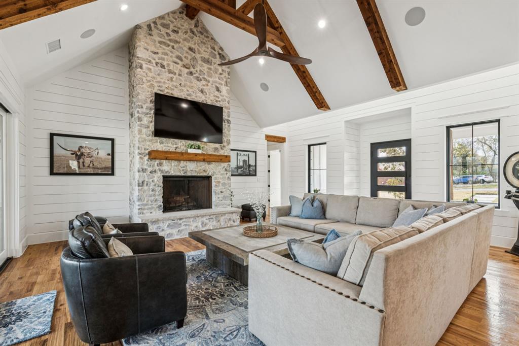 2577 Lone Star Road Celina, TX 75009 - Photo 3 of 40 a living room with furniture and a flat screen tv
