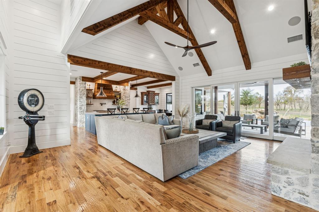 2577 Lone Star Road Celina, TX 75009 - Photo 5 of 40 a living room with furniture and a wooden floor