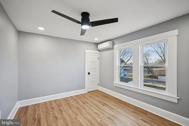 a view of swimming pool with a yard in front of it