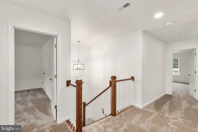 a view of a hallway with a room