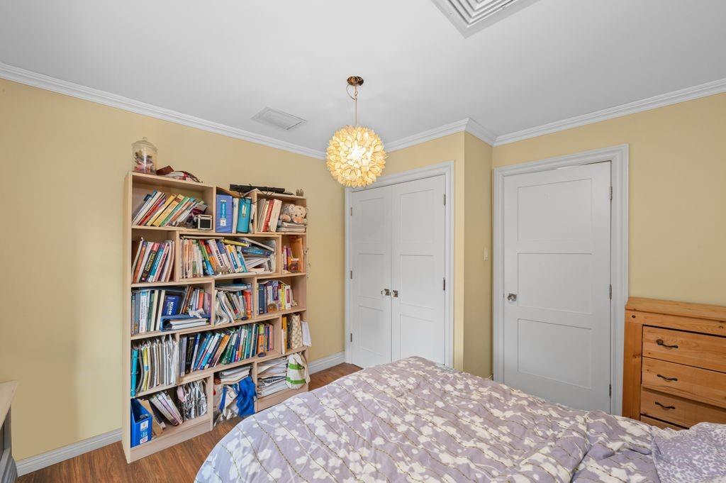 43 78th Street Brooklyn, NY 11209 - Photo 22 of 33 a bedroom with a bed and a book shelf
