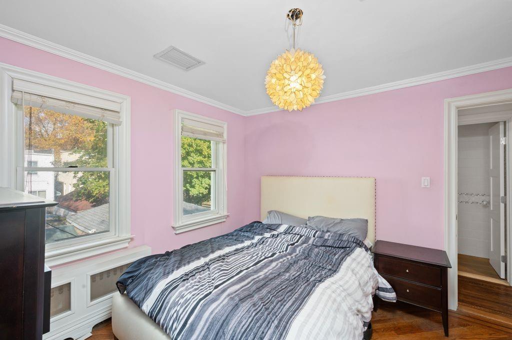 43 78th Street Brooklyn, NY 11209 - Photo 24 of 33 a bed room with a bed and a window