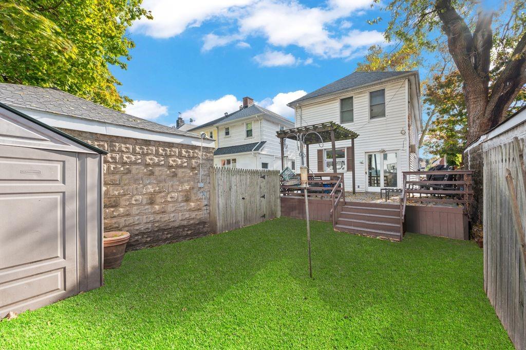 43 78th Street Brooklyn, NY 11209 - Photo 7 of 33 a view of a patio with table and chairs with wooden fence and plants