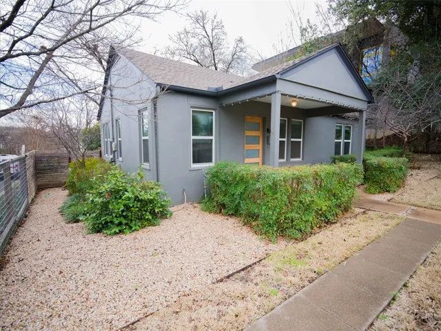 front view of a house with a garden