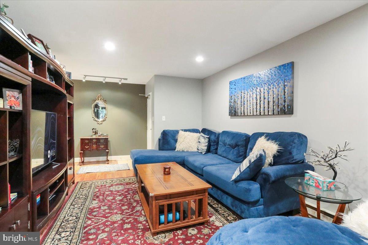 501 Prospect Boulevard Frederick, MD 21701 - Photo 20 of 27 a living room with furniture a flat screen tv and a rug