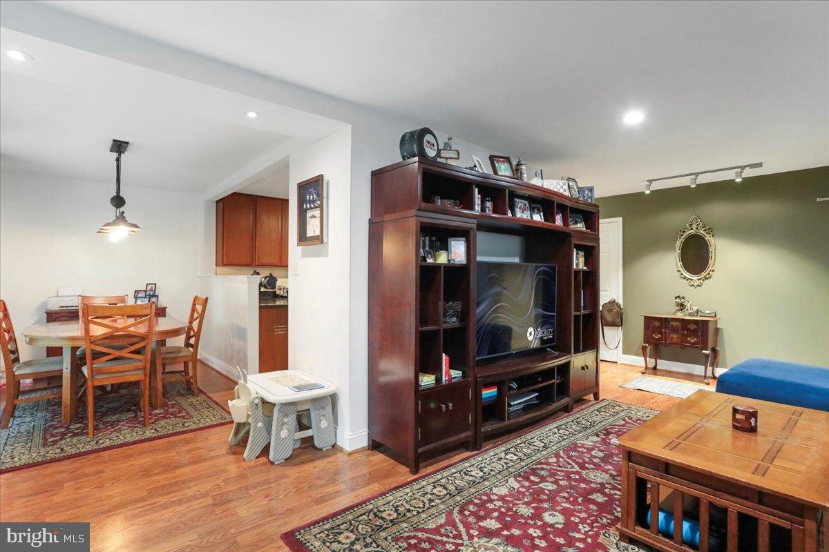 501 Prospect Boulevard Frederick, MD 21701 - Photo 21 of 27 a living room with furniture a flat screen tv and kitchen view