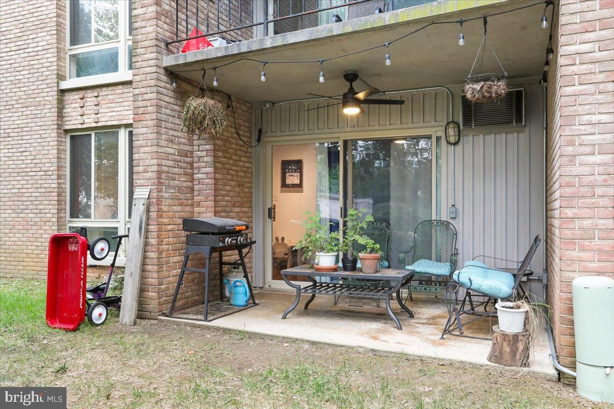 501 Prospect Boulevard Frederick, MD 21701 - Photo 23 of 27 a view of a chairs and table in the back yard of a building