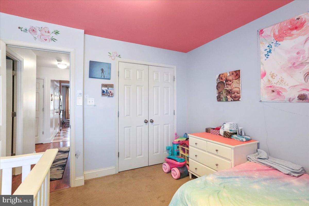 501 Prospect Boulevard Frederick, MD 21701 - Photo 5 of 27 a bedroom with a bed and a cabinets