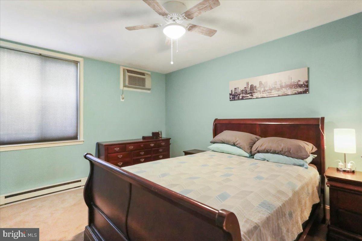 501 Prospect Boulevard Frederick, MD 21701 - Photo 6 of 27 a bedroom with a bed and a chandelier