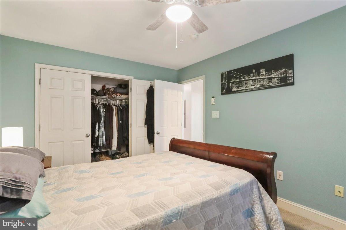 501 Prospect Boulevard Frederick, MD 21701 - Photo 7 of 27 a bedroom with a large bed and a chandelier