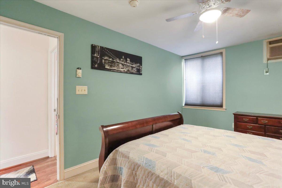 501 Prospect Boulevard Frederick, MD 21701 - Photo 8 of 27 a bedroom with a bed and a chandelier