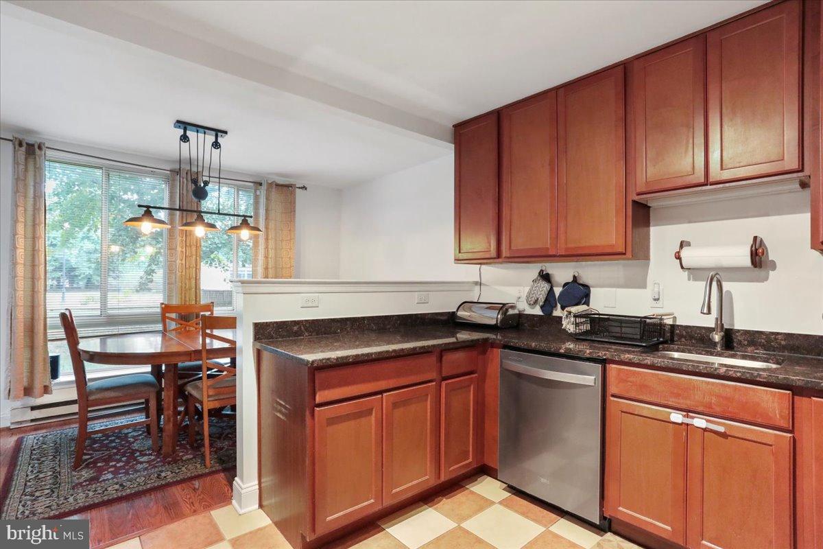 501 Prospect Boulevard Frederick, MD 21701 - Photo 10 of 27 a kitchen with granite countertop a sink stove and cabinets