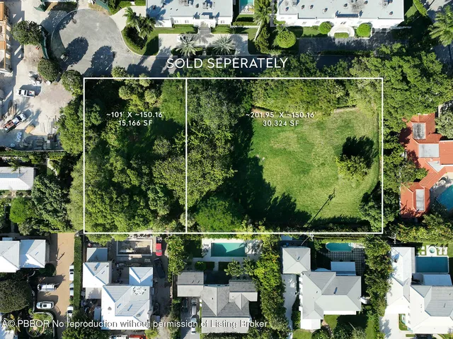 an aerial view of a residential houses with outdoor space