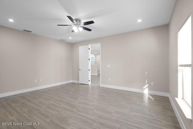 Undisclosed Address Palm Bay, FL 32909 - Photo 15 of 21 a view of an empty room with a window and wooden floor