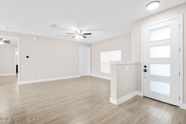 Undisclosed Address Palm Bay, FL 32909 - Photo 3 of 21 an empty room with wooden floor cabinet and windows