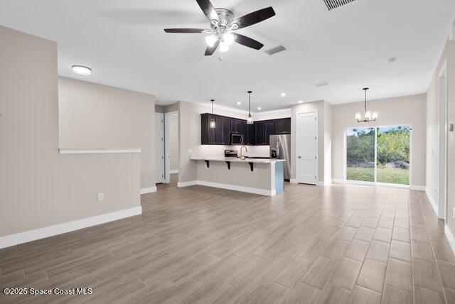 Undisclosed Address Palm Bay, FL 32909 - Photo 5 of 21 a view of kitchen with cabinets and wooden floor