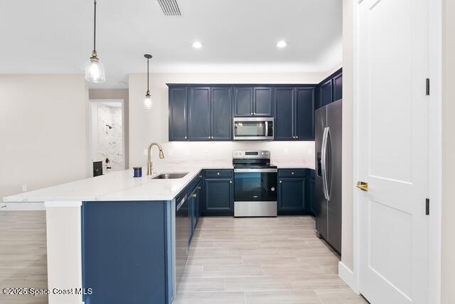 Undisclosed Address Palm Bay, FL 32909 - Photo 8 of 21 a kitchen with kitchen island a sink stainless steel appliances and cabinets