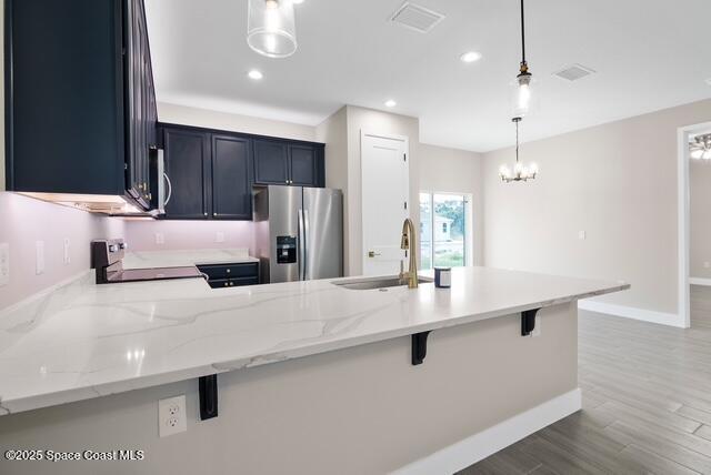Undisclosed Address Palm Bay, FL 32909 - Photo 10 of 21 a kitchen with kitchen island a sink stainless steel appliances and cabinets