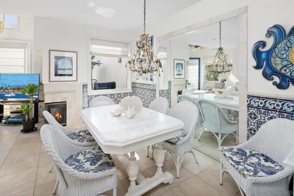 a view of a dining room with furniture and chandelier