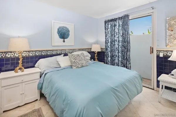 a bedroom with a bed and a cabinets
