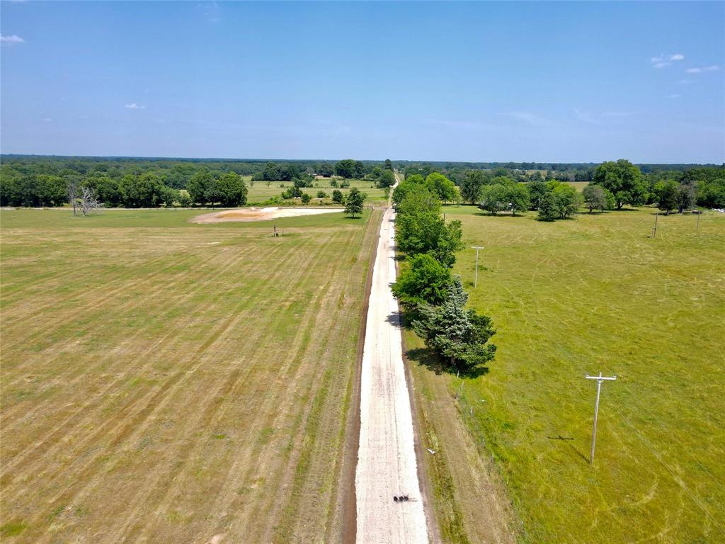 a view of a lake with a garden