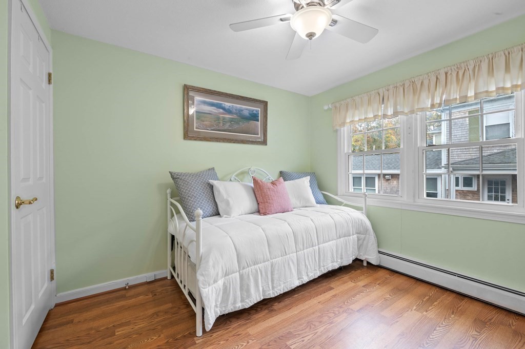 27 Norwood Avenue, Unit 2 Manchester, MA 01944 - Photo 11 of 17 a bedroom with a bed and a window