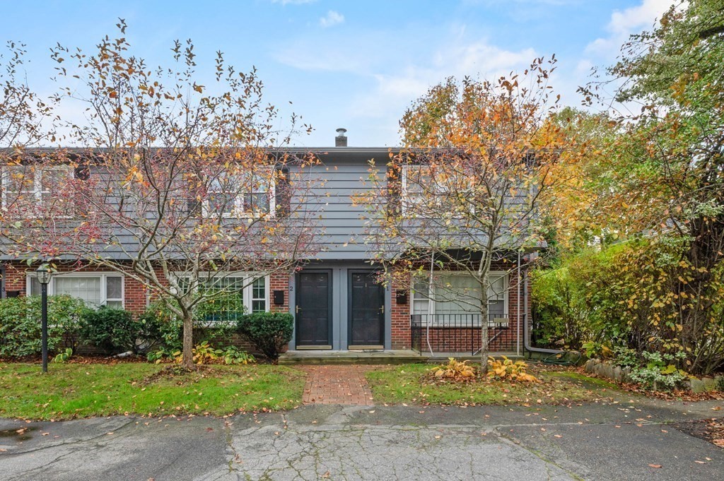 27 Norwood Avenue, Unit 2 Manchester, MA 01944 - Photo 15 of 17 front view of a house with a garden