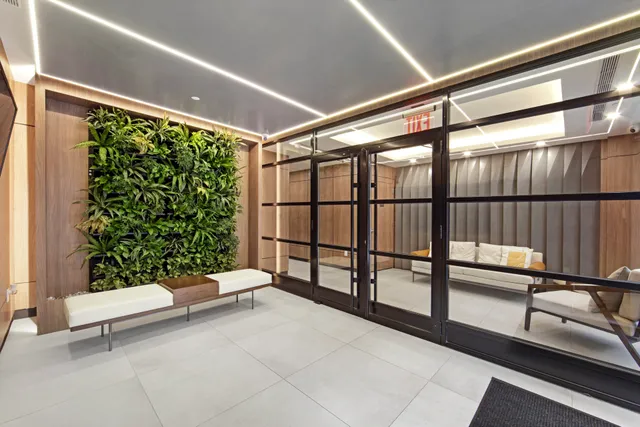 a bathroom with a toilet sink and shower