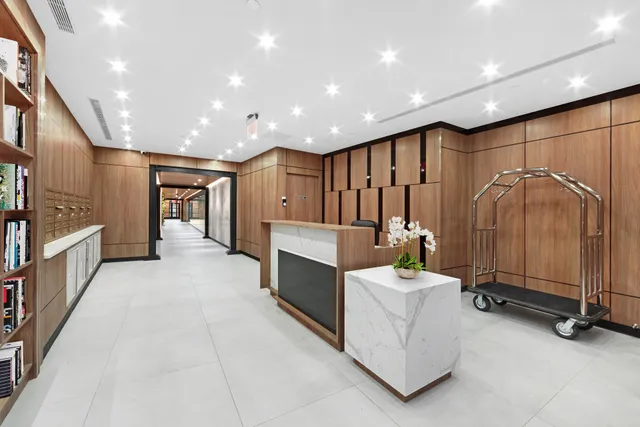 a balcony with table and white walls