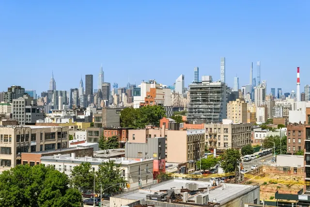 a view of a patio with couches and swimming pool