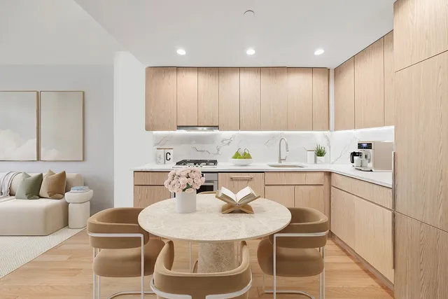 a view of a room with wooden floor and a ceiling fan