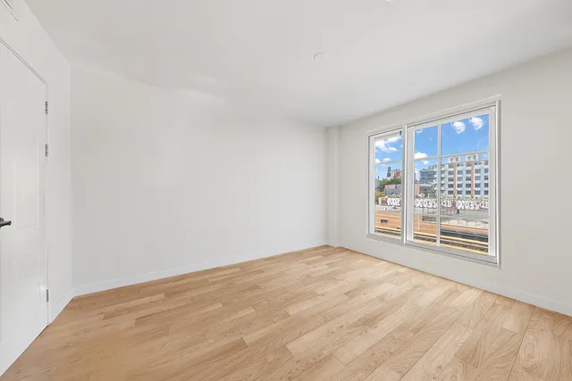 a bedroom with a large bed and a couch