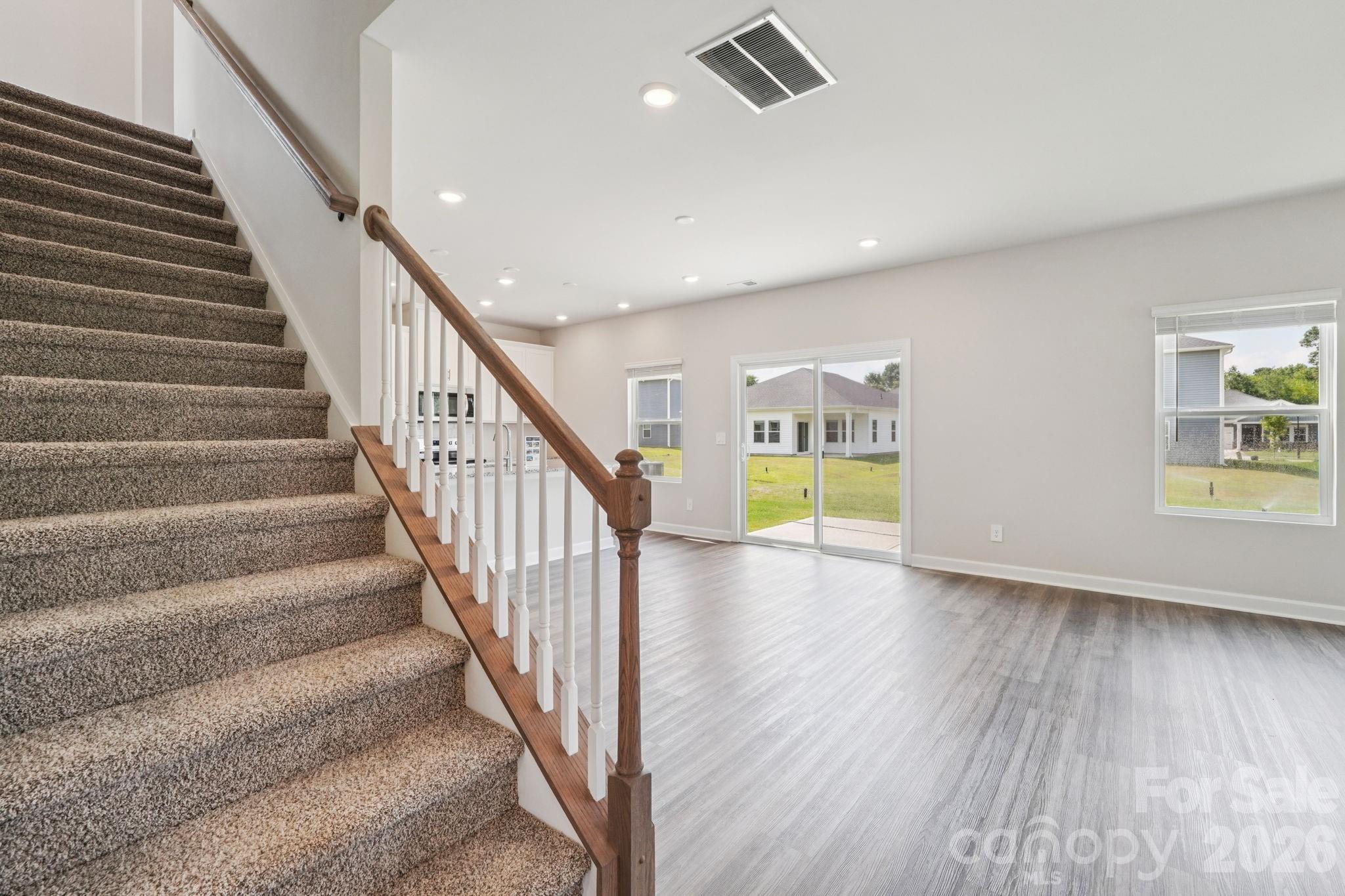 2452 Chartwell Street Stanley, NC 28164 - Photo 9 of 15 a view of an entryway with wooden floor