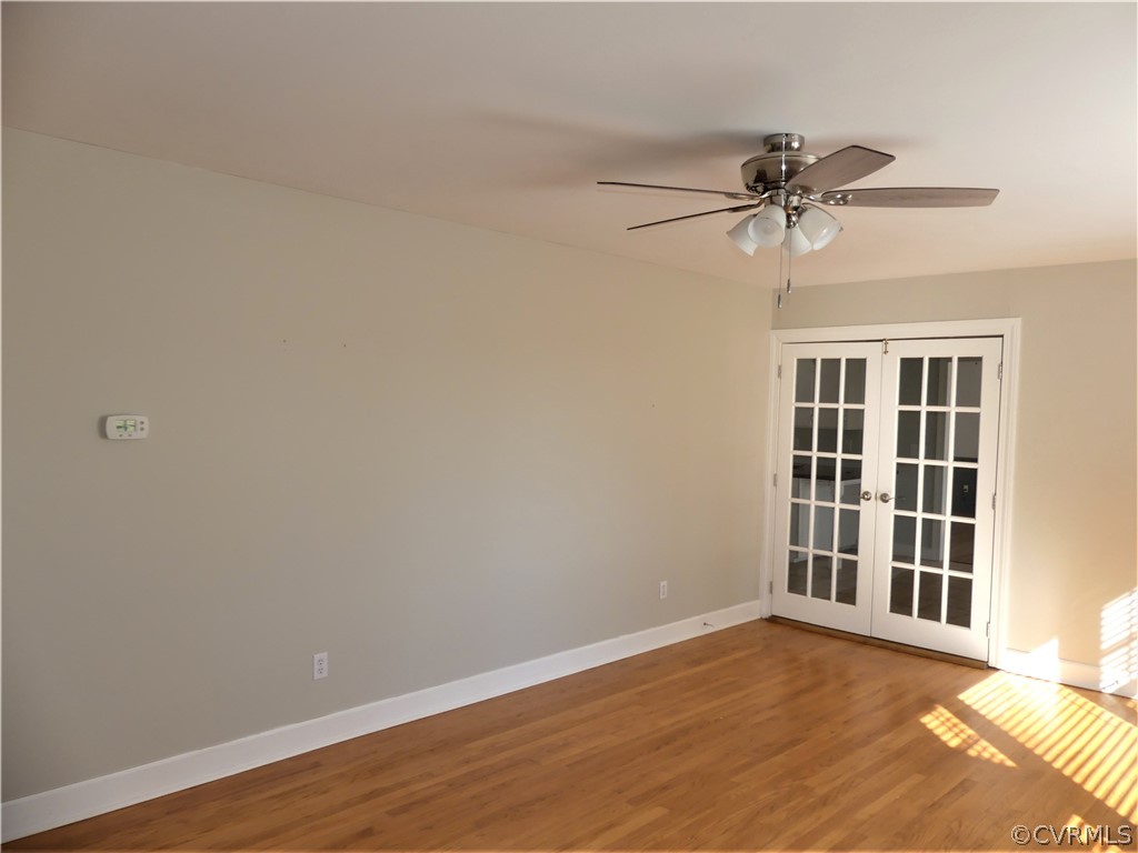 1325 Courthouse Road Chase City, VA 23924 - Photo 11 of 49 a view of a big room with wooden floor and windows in a room