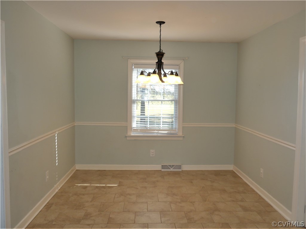 1325 Courthouse Road Chase City, VA 23924 - Photo 15 of 49 a view of a room with windows and chandelier