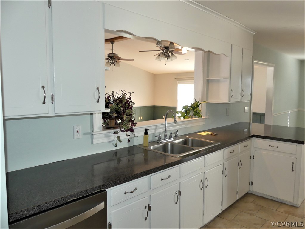 1325 Courthouse Road Chase City, VA 23924 - Photo 18 of 49 a kitchen with a sink dishwasher and white cabinets
