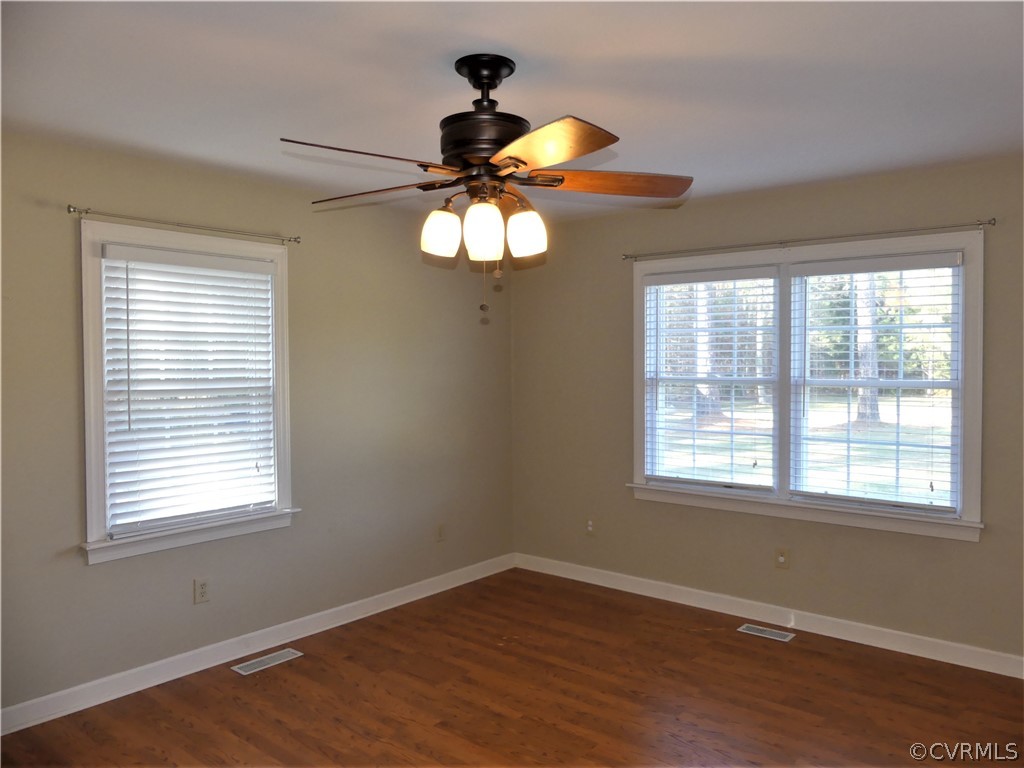 1325 Courthouse Road Chase City, VA 23924 - Photo 25 of 49 a view of an empty room with wooden floor and a window