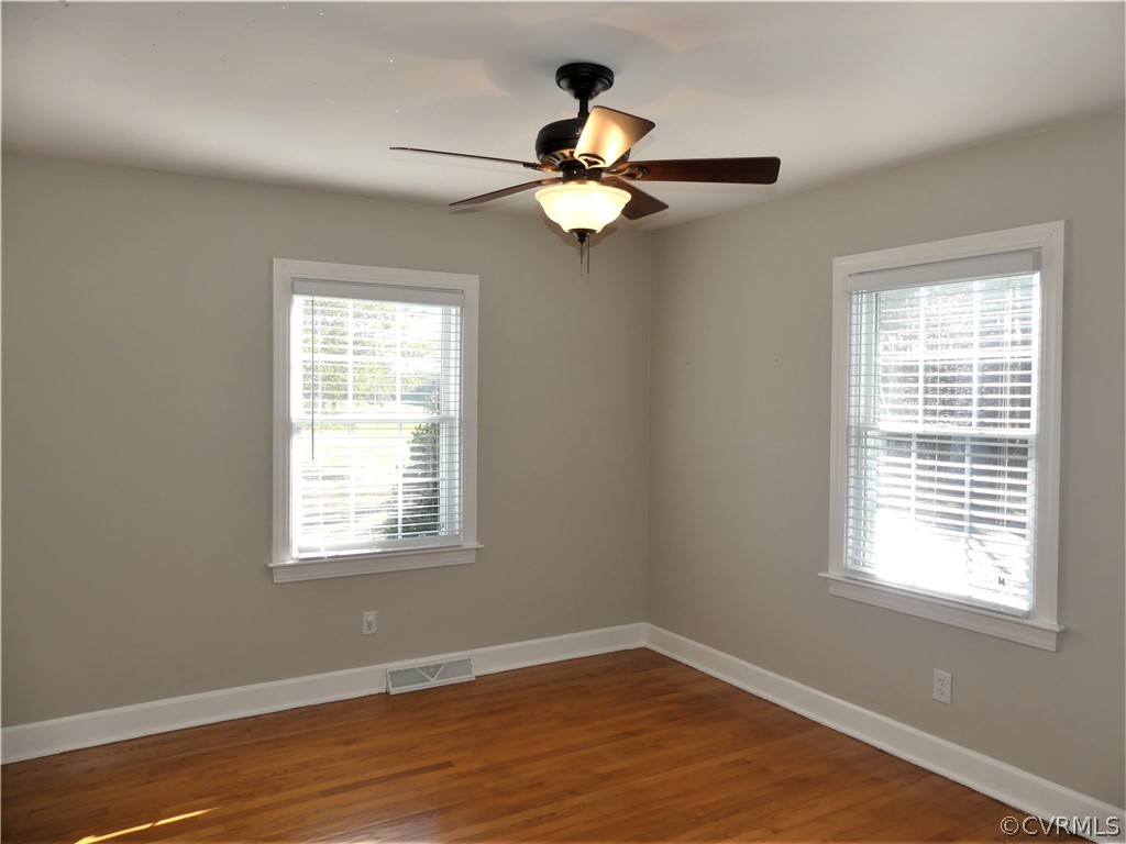 1325 Courthouse Road Chase City, VA 23924 - Photo 28 of 49 a view of an empty room with wooden floor and a window