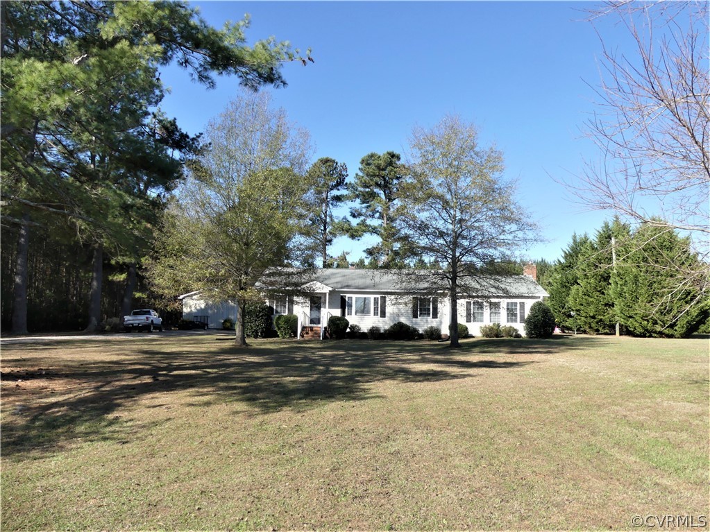 1325 Courthouse Road Chase City, VA 23924 - Photo 3 of 49 a view of large pool with lawn chairs and plants
